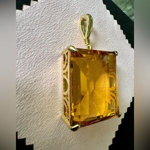 Elegant Gold Tone and Amber Colored Enhancer